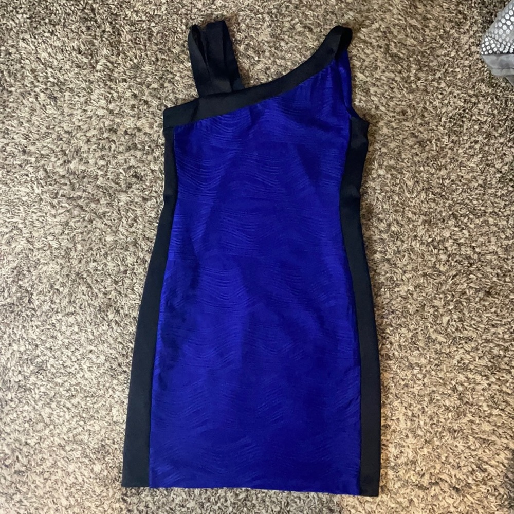 Purple cocktail dress fully lined with double shoulder strap on one side.
